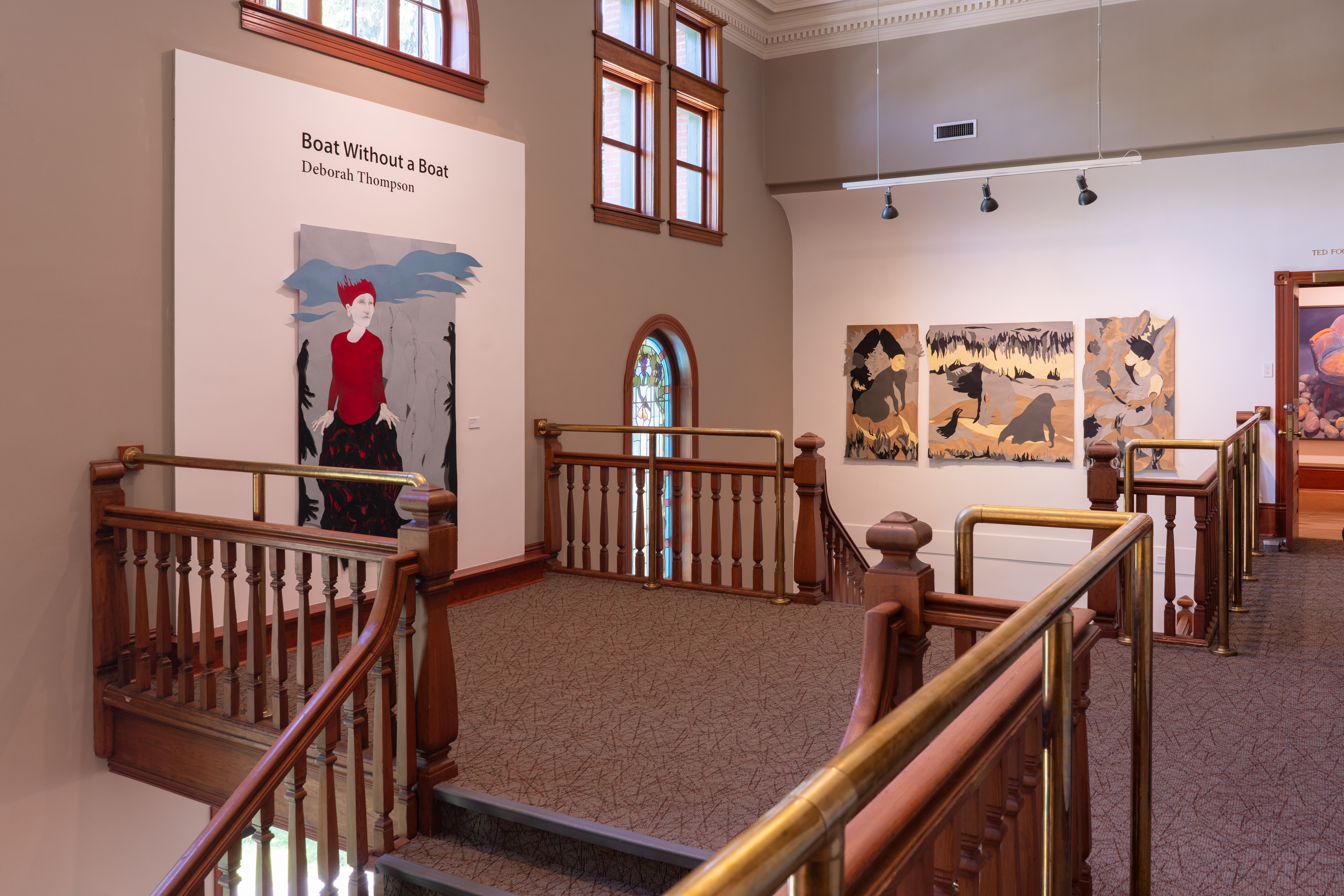 Across the landing with title wall/ Vesuivia and triptych: Once We Were Whole in the stairwell.